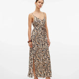 Elevated casual maxi dress featuring tiger-inspired print and feminine flowy silhouette for warm-weather wear.