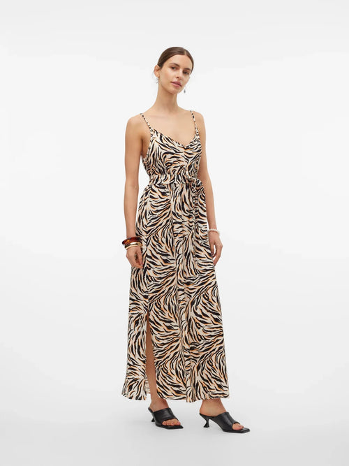 Elevated casual maxi dress featuring tiger-inspired print and feminine flowy silhouette for warm-weather wear.