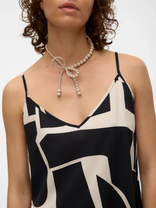 Trendy monochrome cami top with contemporary graphic print and relaxed boutique-inspired fit.