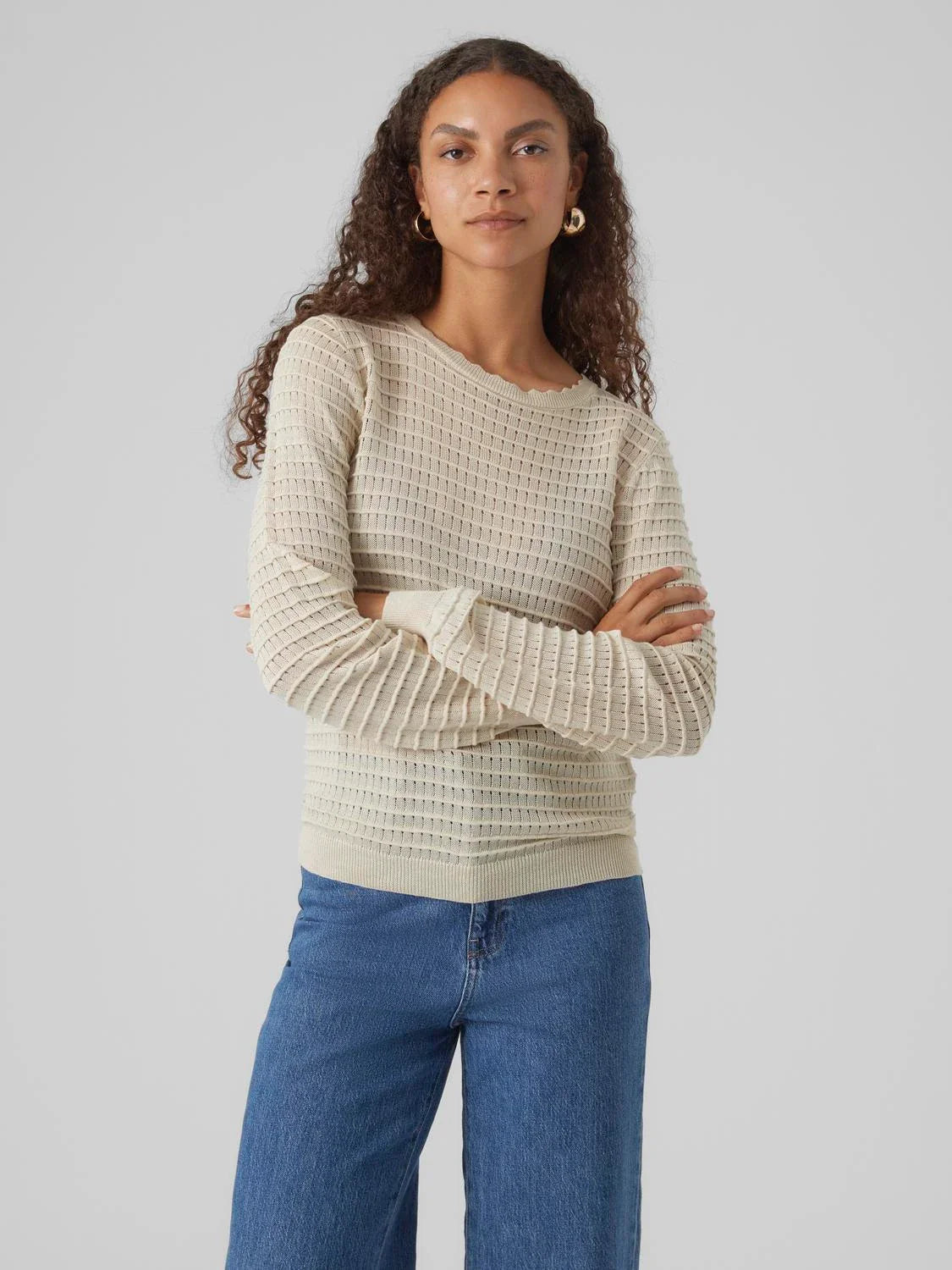 Women’s cream long sleeve sweater featuring textured knit pattern and soft stretch fit for timeless wardrobe essentials.