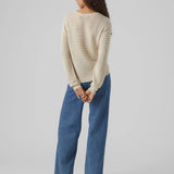 Soft ivory pointelle sweater featuring lightweight knit fabric and long sleeves for elegant casual women’s style.