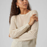 Chic cream long sleeve sweater with textured ribbed knit and feminine fitted style for versatile everyday fashion.