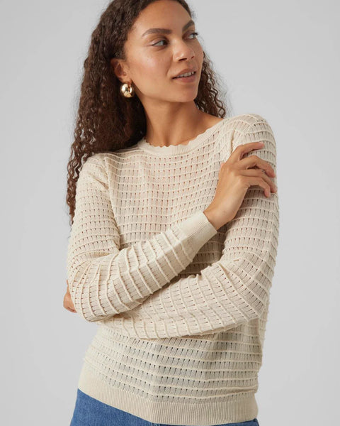 Chic cream long sleeve sweater with textured ribbed knit and feminine fitted style for versatile everyday fashion.