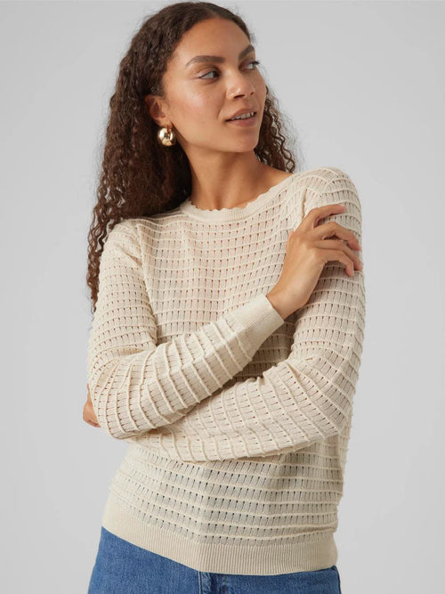Chic cream long sleeve sweater with textured ribbed knit and feminine fitted style for versatile everyday fashion.