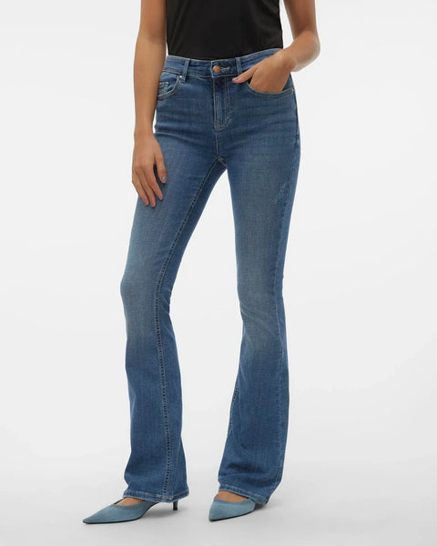 Women’s slim flare denim jeans with medium blue wash and elongating fit for polished casual outfits.