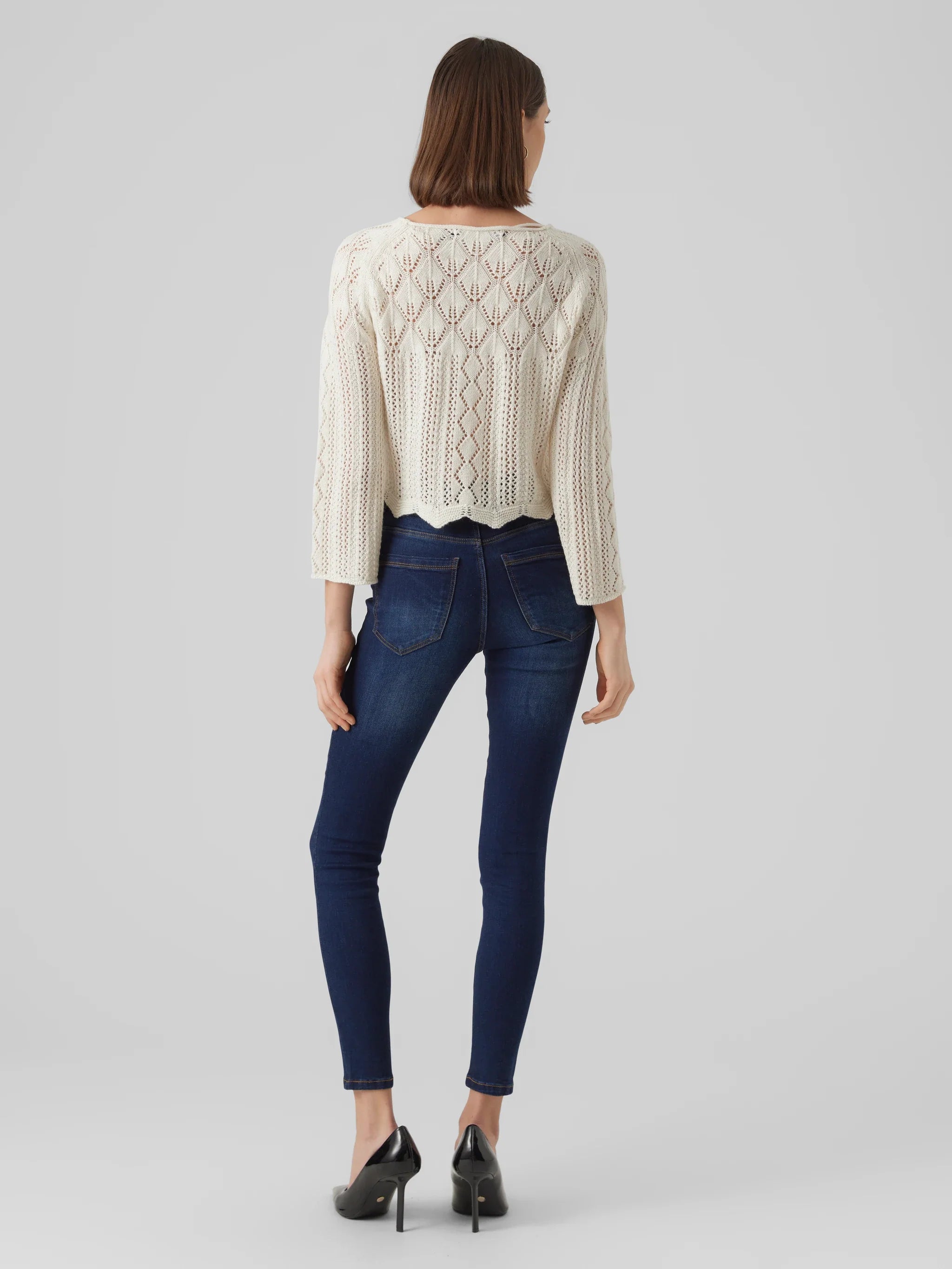 Women’s boho knit sweater in ivory with romantic crochet detailing and elevated casual chic style.