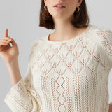 Women’s ivory pointelle knit sweater with boho chic style and lightweight open-knit texture.