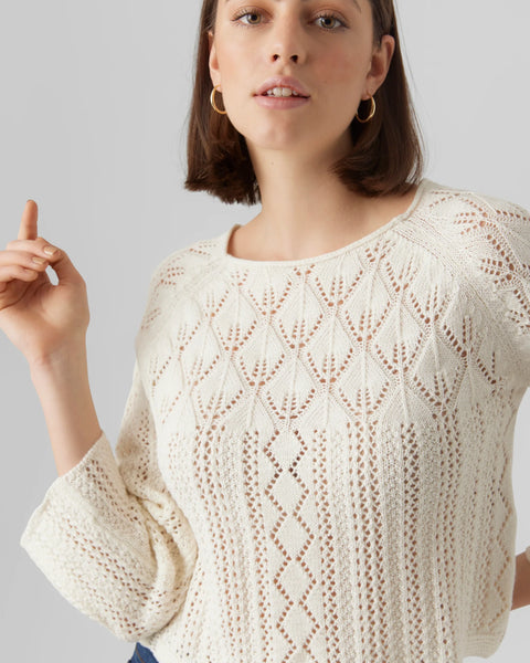 Women’s ivory pointelle knit sweater with boho chic style and lightweight open-knit texture.