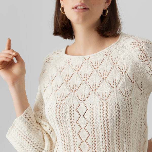 Women’s ivory pointelle knit sweater with boho chic style and lightweight open-knit texture.
