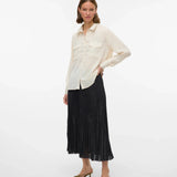 Women’s oversized ivory shirt featuring long sleeves, button front, and relaxed silhouette for effortless layering.