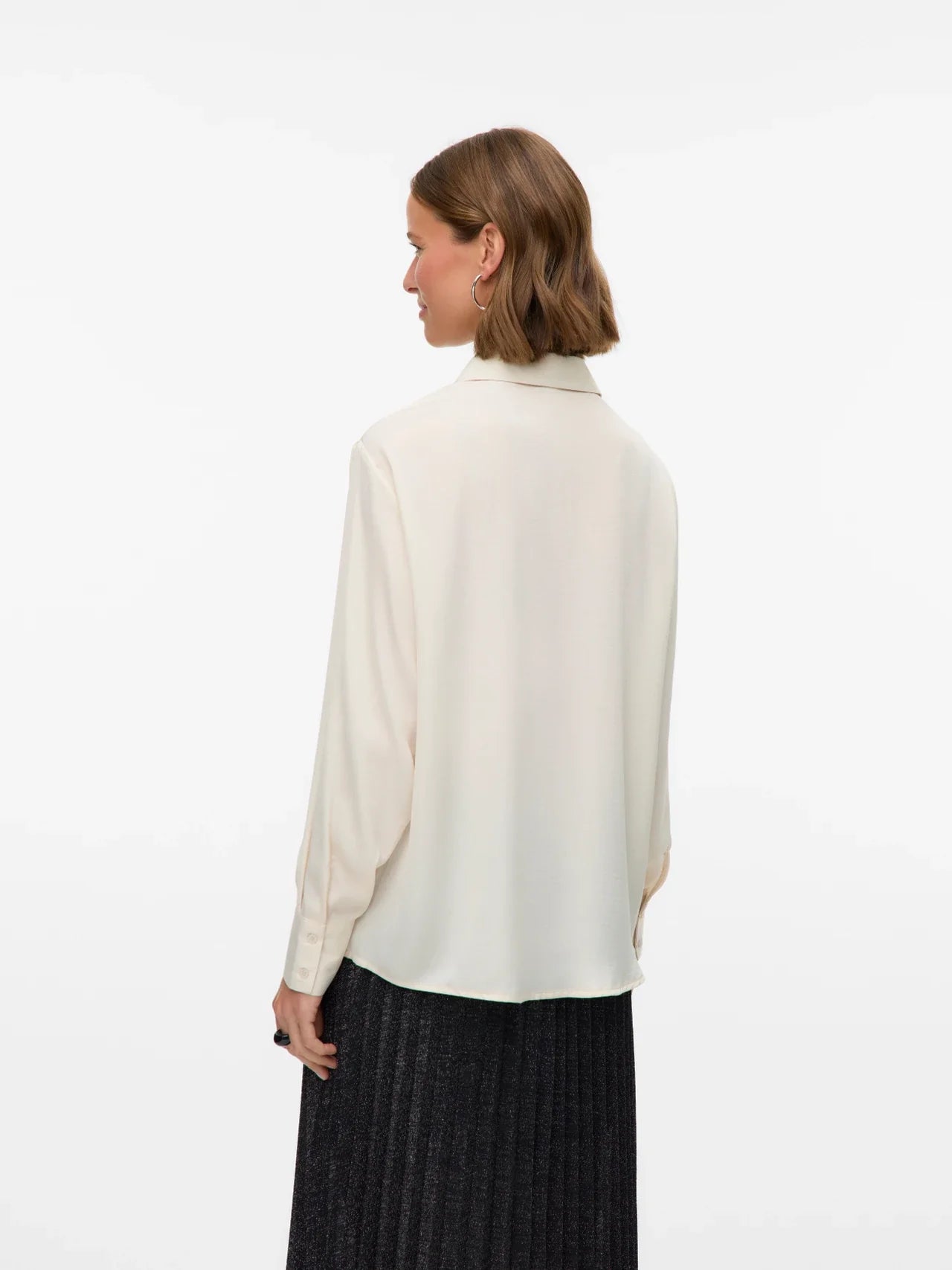 Women’s cream oversized button-up blouse with utility pockets and collared neckline for chic minimalist style.