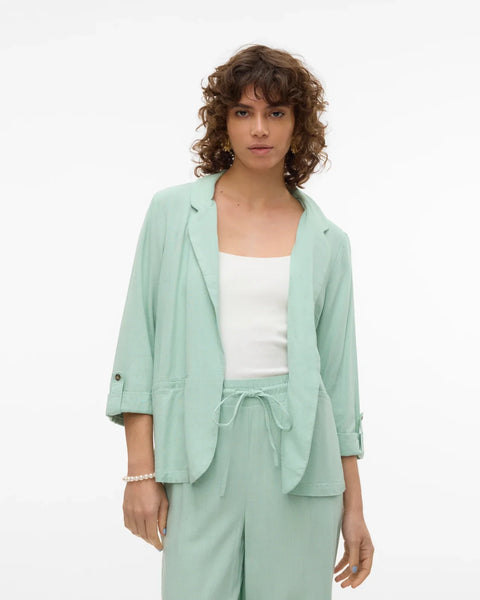 Minimalist women’s mint layering jacket with soft tailoring and versatile spring summer styling.