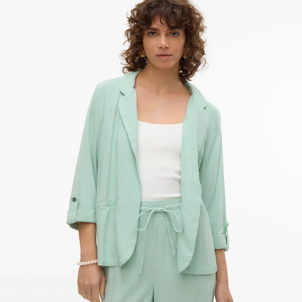 Minimalist women’s mint layering jacket with soft tailoring and versatile spring summer styling.