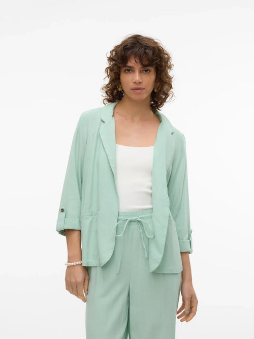 Minimalist women’s mint layering jacket with soft tailoring and versatile spring summer styling.