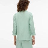 Soft mint green blazer for women featuring relaxed tailoring and sophisticated casual chic appeal.
