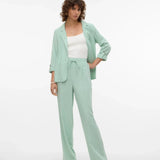 Contemporary mint layering piece with rolled cuffs and chic relaxed silhouette for modern wardrobes.