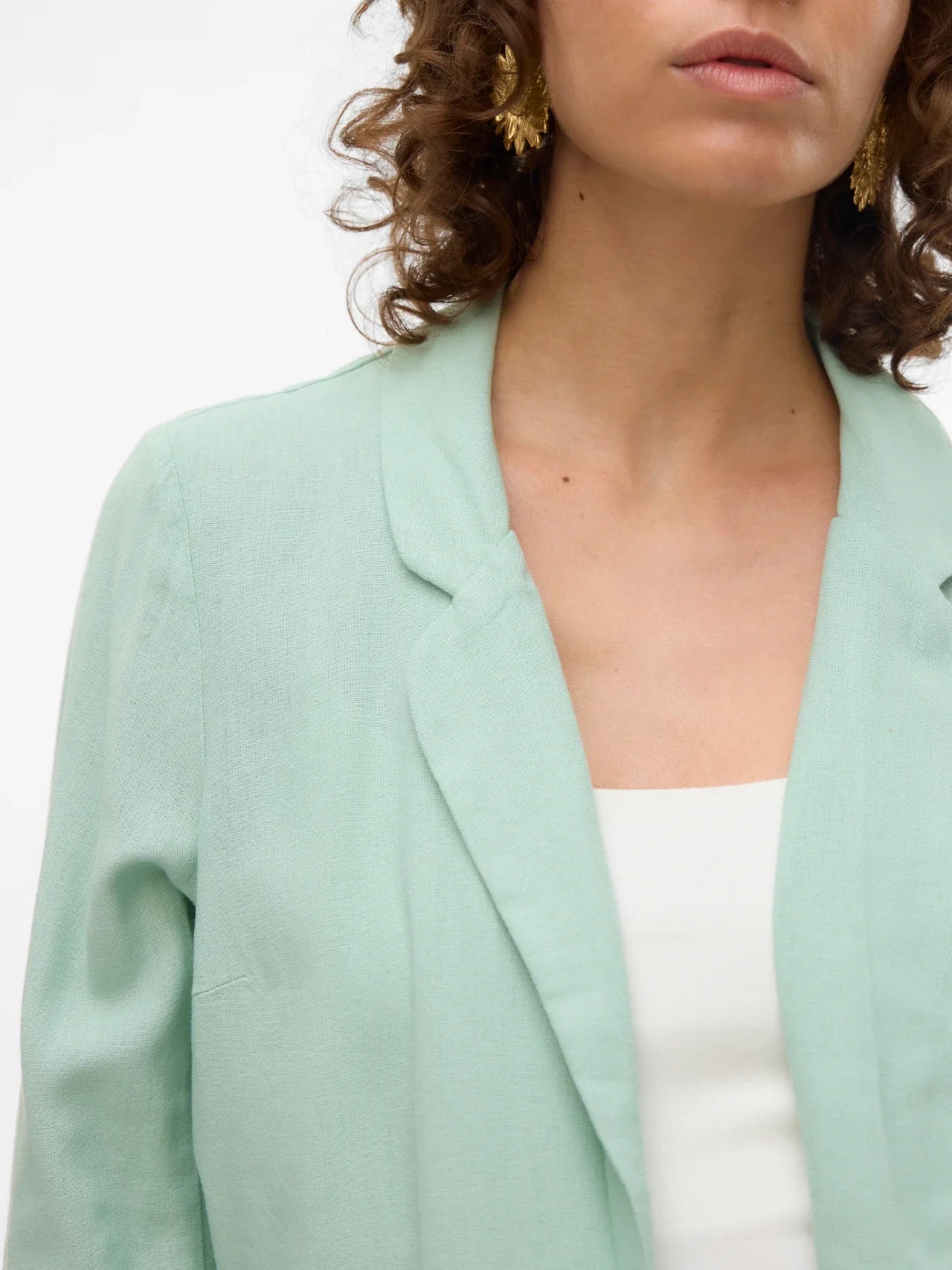 Modern mint green cover-up jacket with fluid drape and elevated resort casual versatility.