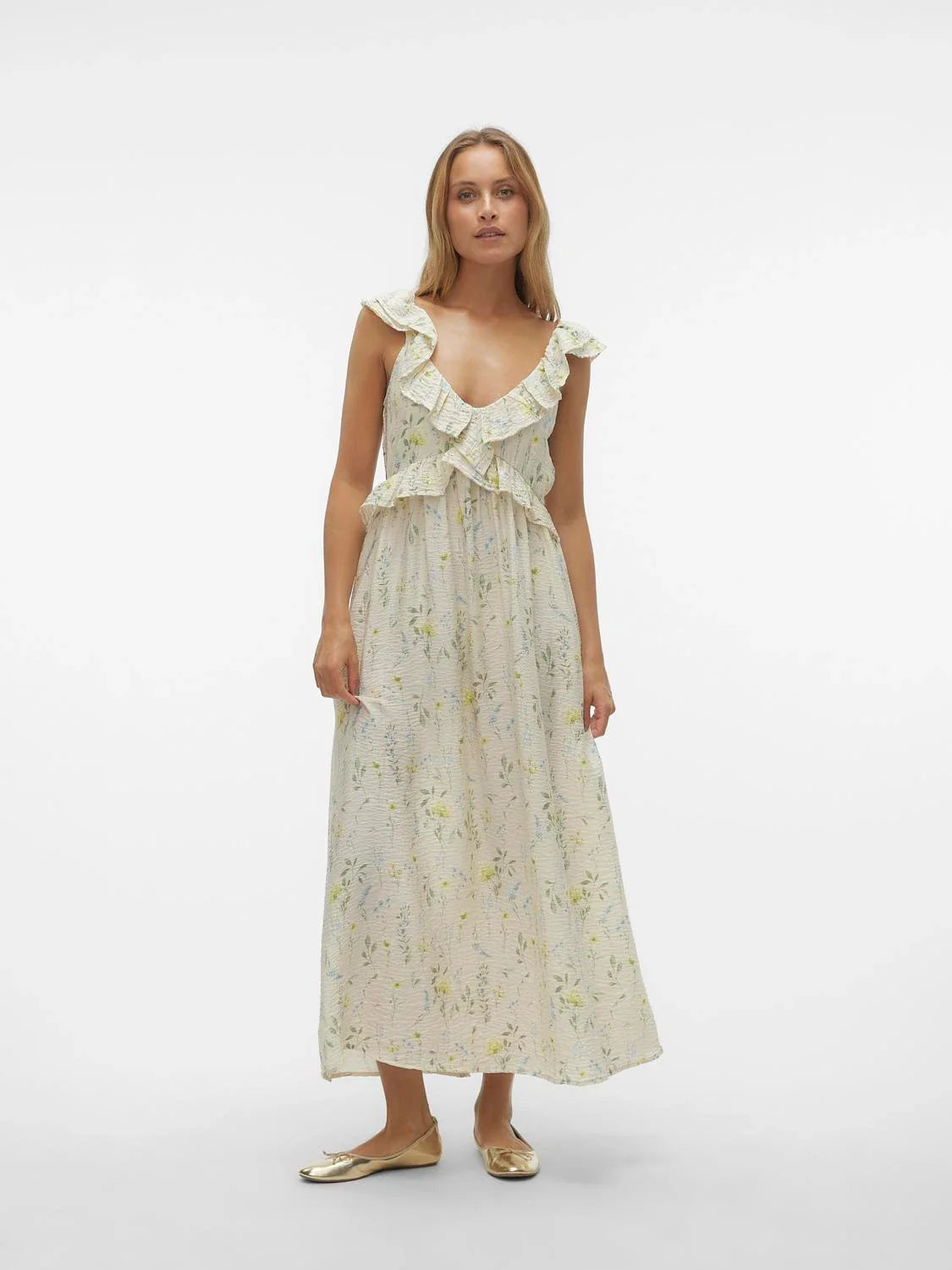 Feminine ruffle-front dress in soft ivory floral print with dreamy resort and vacation-ready aesthetic.