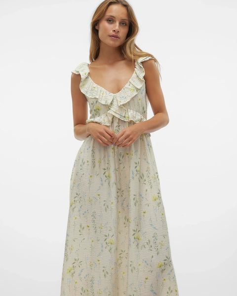 Romantic floral maxi dress with cascading ruffle neckline and soft cottagecore-inspired feminine silhouette.
