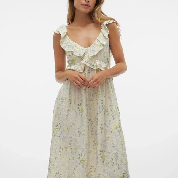 Romantic floral maxi dress with cascading ruffle neckline and soft cottagecore-inspired feminine silhouette.