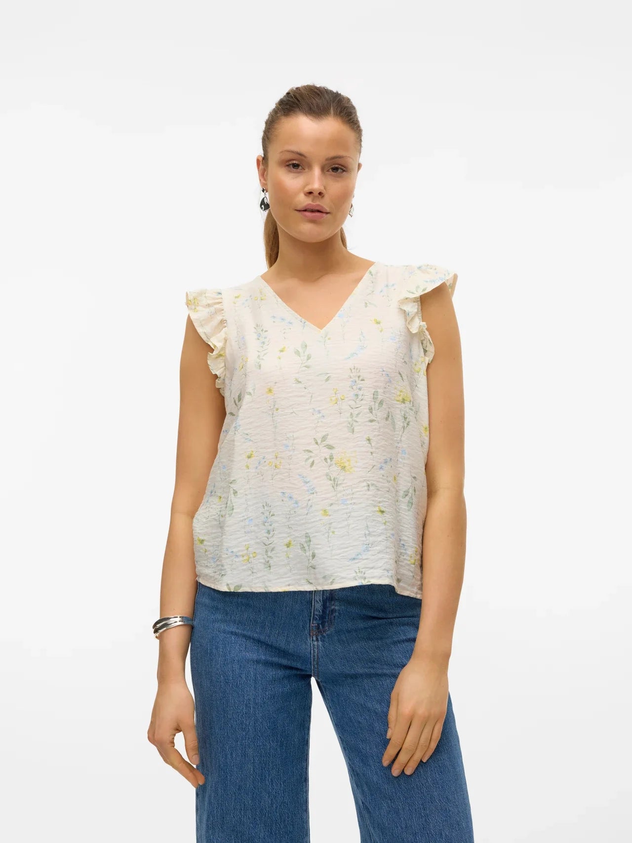 Airy botanical print top with flutter shoulder accents and elegant minimalist bohemian styling.