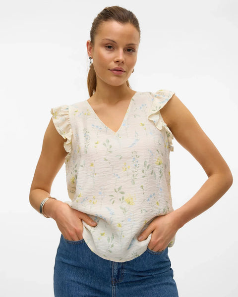 Chic floral V-neck top with flutter sleeve detailing and airy boho-inspired everyday styling.