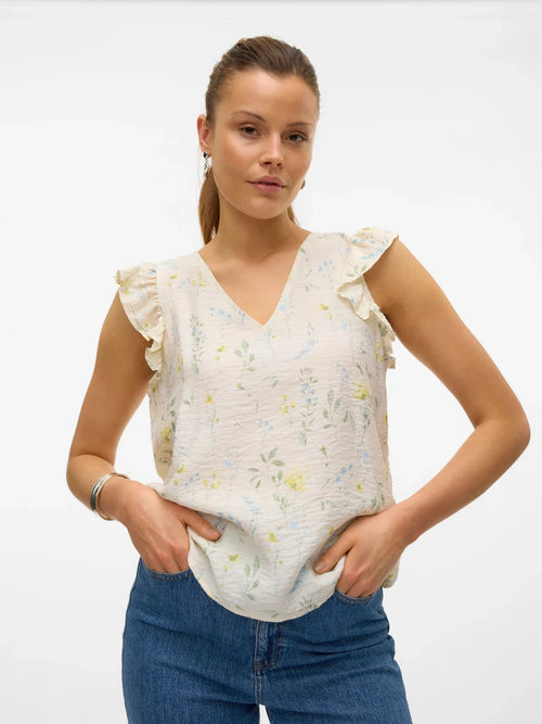 Chic floral V-neck top with flutter sleeve detailing and airy boho-inspired everyday styling.