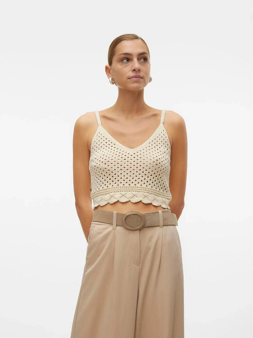 Women’s airy crochet knit cami featuring spaghetti straps, scalloped hemline, and lightweight texture for modern summer style.