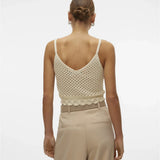 Fashion-forward crochet crop camisole featuring delicate open weave and feminine fitted silhouette for trendy summer wardrobes.