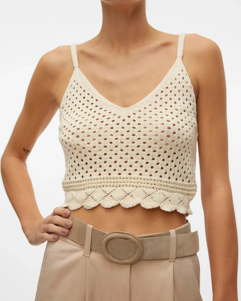 Coastal-inspired knit bralette top featuring breathable crochet design and feminine scalloped hem for effortless layering.
