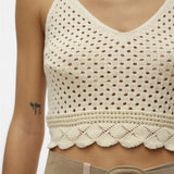 Lightweight ivory crochet bralette with V-neckline and open-knit pattern for chic vacation and festival fashion.