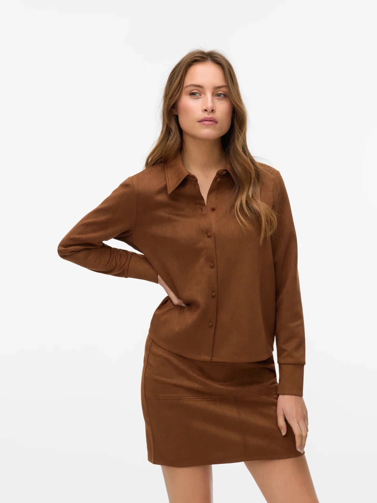 Women’s brown faux suede button-down shirt with long sleeves and collared neckline for elevated fall outfits.