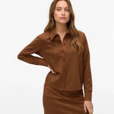 Women’s brown faux suede button-down shirt with long sleeves and collared neckline for elevated fall outfits.