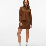Women’s brown faux suede shirt with tonal buttons and classic collar, a versatile top for fall fashion and layering.