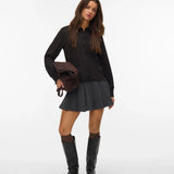 Women's versatile black collared shirt with tonal button closure and relaxed silhouette for day-to-night styling.