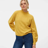 Women’s golden yellow knit sweater with mock neckline and relaxed fit for casual everyday winter outfits.