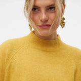 Women’s yellow relaxed-fit sweater with mock neck and soft knit texture for bright fall and winter wardrobe styling.