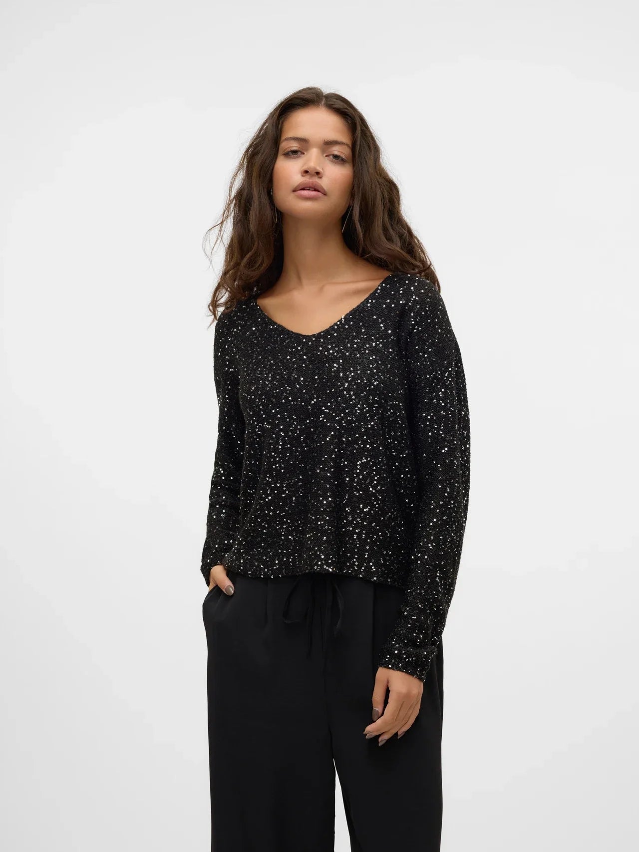 Women's black sequin top with V-neck and long sleeves, sparkly party top for holiday, cocktail and evening outfits.