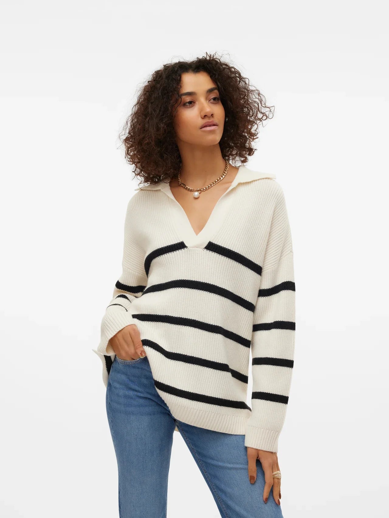 Chic oversized striped sweater in cream and black with cozy ribbed knit texture and modern style.