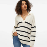 Chic oversized striped sweater in cream and black with cozy ribbed knit texture and modern style.