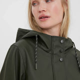 Elevated olive green outerwear with sleek snap-button detail and city-ready sophistication