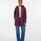 Women’s burgundy hooded rain jacket with flattering adjustable waist for versatile everyday, travel, and commuter outerwear.