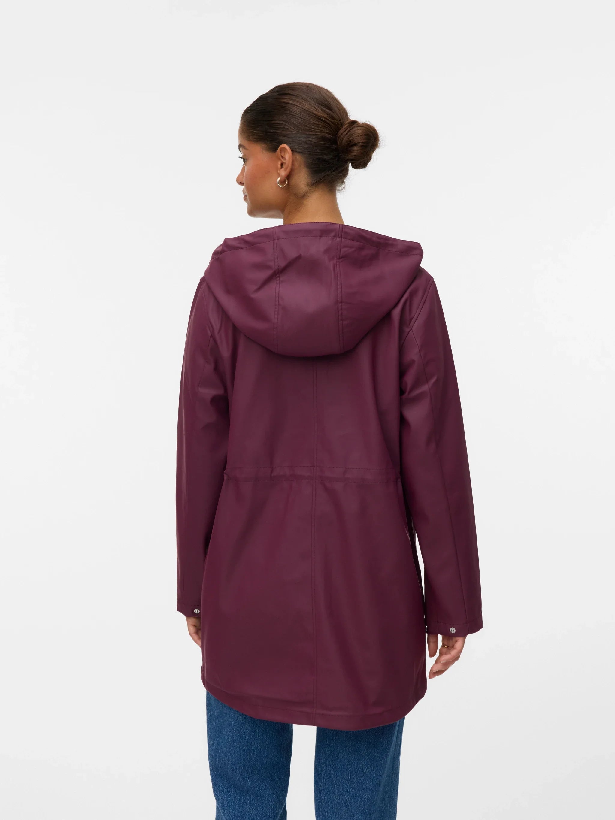 Women’s plum hooded rain jacket with front pockets and adjustable waist for commuting and travel.