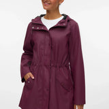 Women’s burgundy hooded raincoat with adjustable drawstring waist, front pockets, and snap closure for stylish rainy-day outfits.
