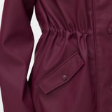 Detail of luxe everyday raincoat with adjustable waist and contemporary Scandinavian-inspired style.