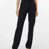 Chic black wide leg dress pants featuring high waist tailoring and sophisticated modern workwear aesthetic.
