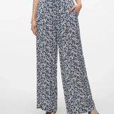 Stylish monochrome floral pants with fluid movement and contemporary fashion-forward silhouette.