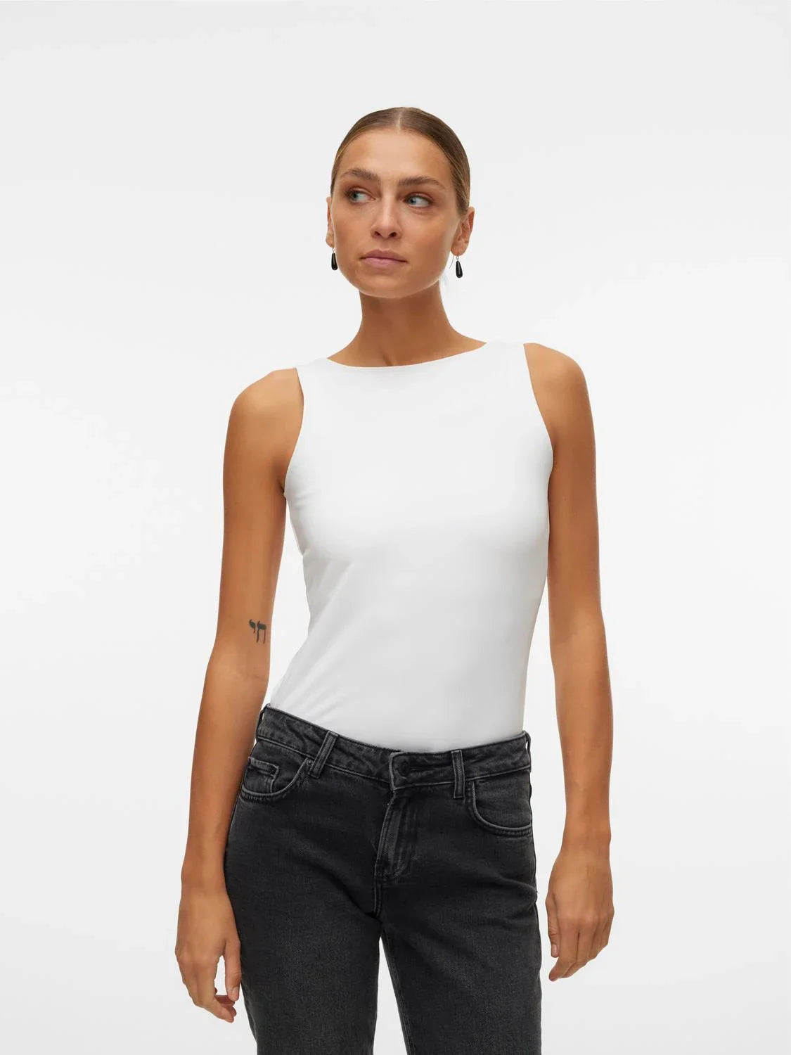 Chic white fitted tank bodysuit for women featuring a clean silhouette and elevated everyday capsule wardrobe aesthetic.