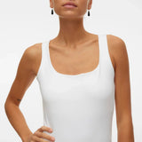 Elevated basic white tank top featuring a fitted silhouette and clean luxury-inspired everyday style.