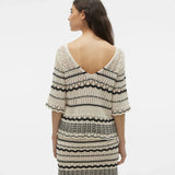 Chic open stitch sweater top with contrast black stripe pattern and relaxed fit for modern boutique wardrobes.